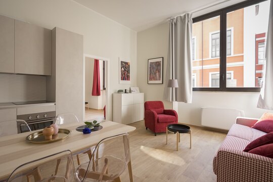 Bright kitchen and dining space with clear counters and a dining table